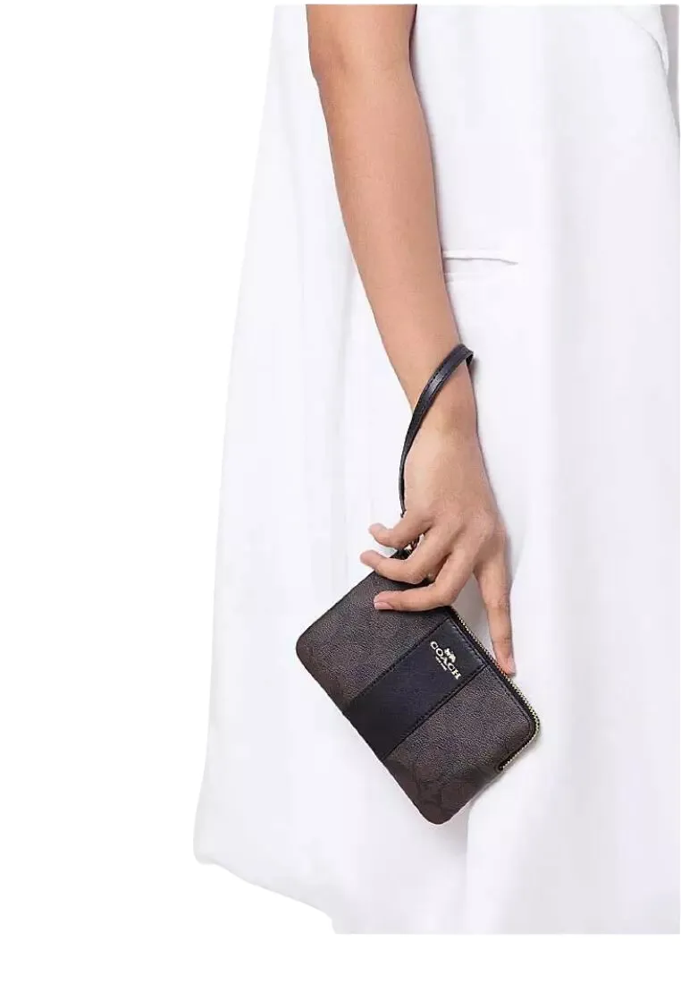 Coach Corner Zip Wristlet In Signature Canvas In Brown Black CS602